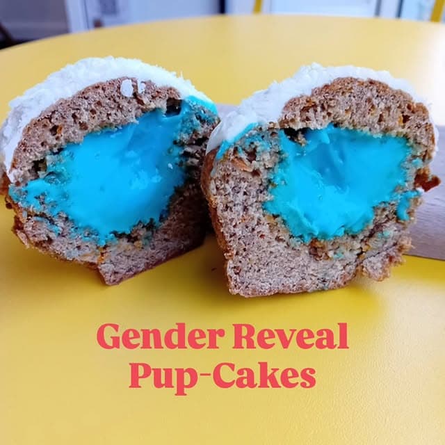 Gender Reveal Pup-Cakes cut open on a yellow café table
